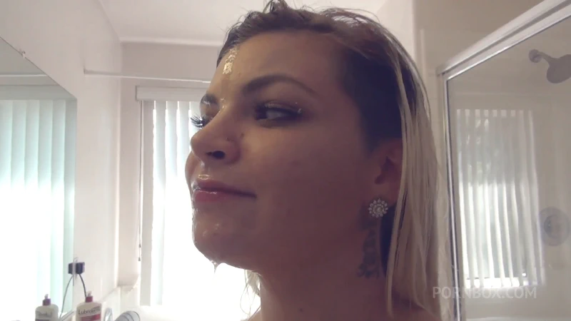 Alex Little admires her cum covered face in the mirror