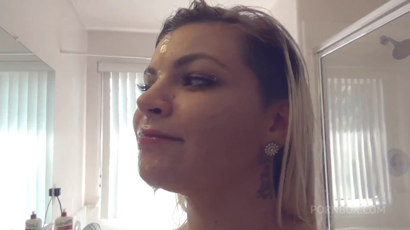 Alex Little admires her cum covered face in the mirror